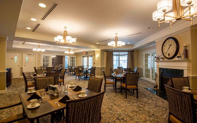 Elegant dining room with tables set for meals