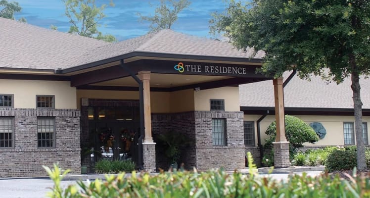 View of the entrance of The Residence senior living facility.