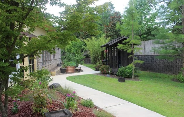 Pathway through a landscaped garden at The Residence