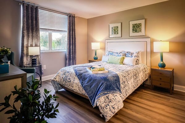 Cozy bedroom with a made bed and natural light