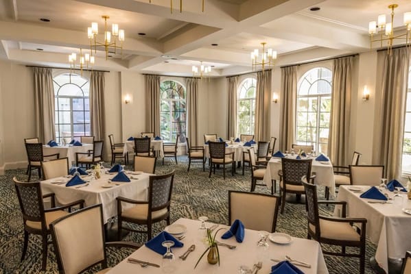 Elegant dining room setup with tables and tableware