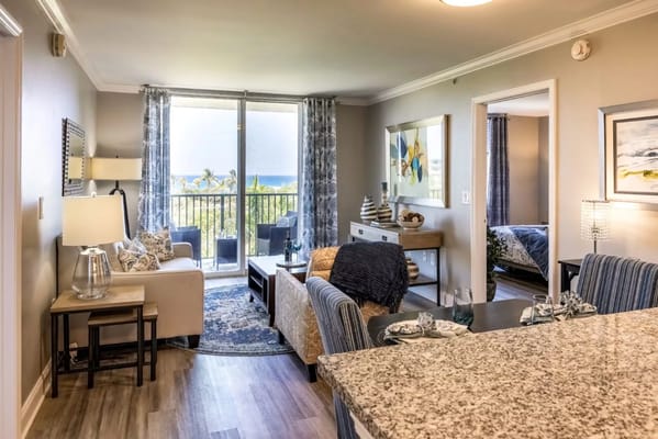 Modern, well-decorated living room area with a view