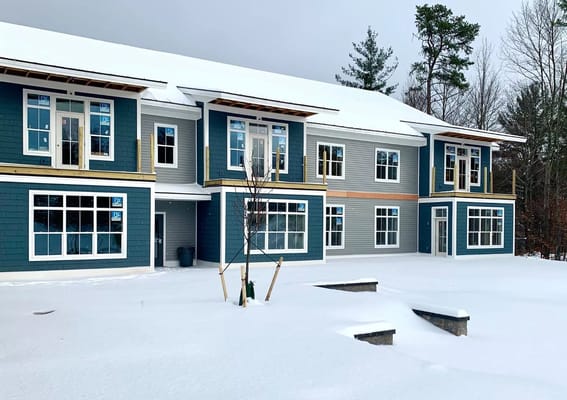 Exterior view of The Residences at the Essex covered in snow