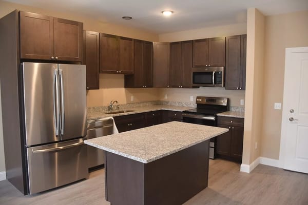 Spacious kitchen with granite countertops and stainless steel appliances