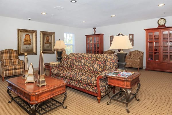 Bright interior common area with floral sofa and decor