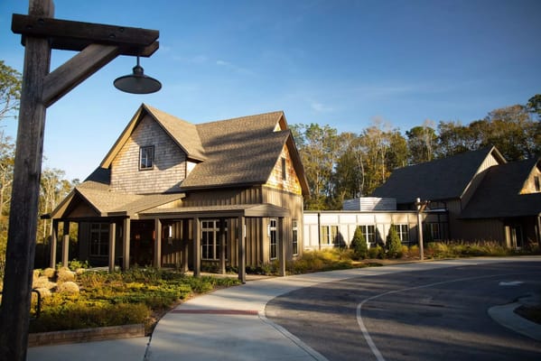 Front view of The Retreat at SAAD Hospice building with landscaped surroundings
