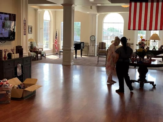 Residents in a common area with social activities