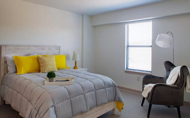 Bright interior of a resident bedroom with modern decor