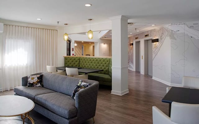 Bright common area with modern seating and decor