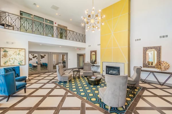 Bright lounge area with modern seating and decorative accessories