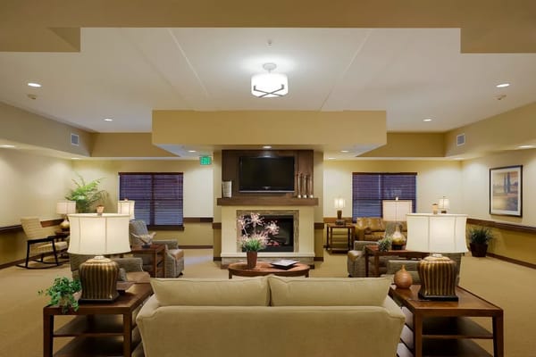 Cozy common area with seating and a fireplace