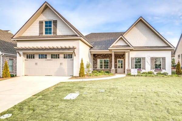 Front view of The Springs of Mill Lakes facility with a landscaped lawn.