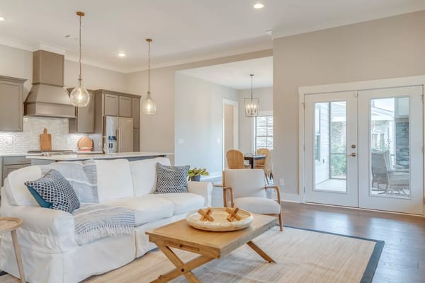 Bright living room with white sofa and wooden coffee table