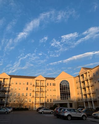 The exterior of The St. Paul Senior Living Community under a blue sky.