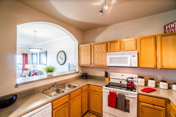 Bright kitchen with wooden cabinets and modern appliances