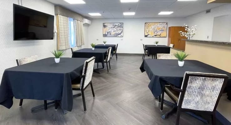 Dining area with black tablecloths and decorations
