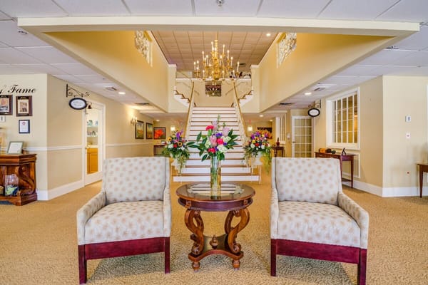 Bright lobby with floral arrangements and seating