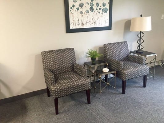 Cozy seating area with chairs and lamp