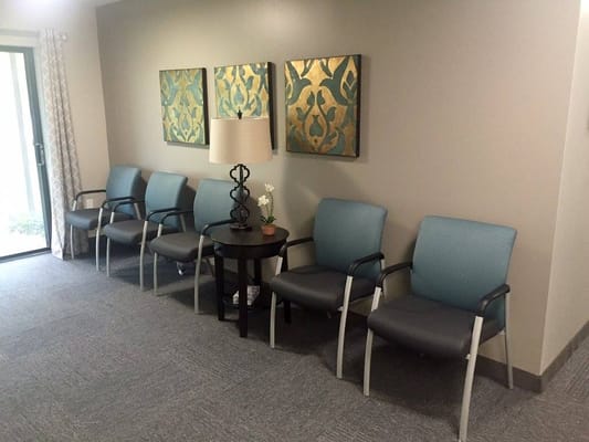 Common area with seating and decorative artwork