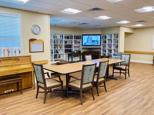 Bright common area with bookshelves and seating