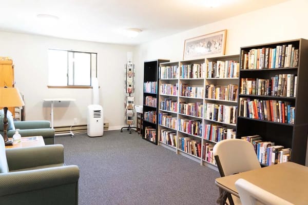 Common area with bookshelves and seating