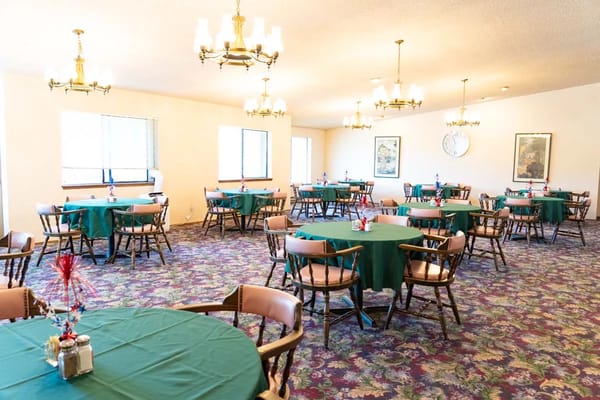 Dining room with tables set for a meal