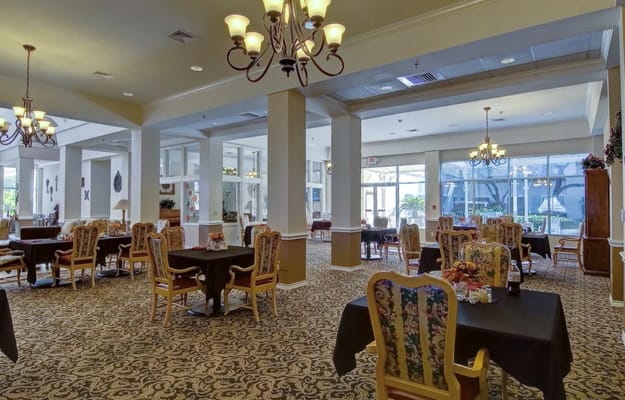 Elegant dining room with tables and chairs at The Waterford