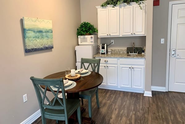 Small dining area with kitchenette and modern decor