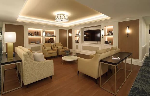 Common area lounge with seating and TV