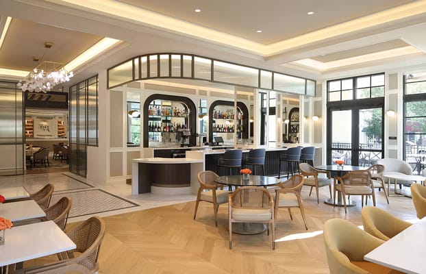 Elegant dining area with stylish seating and bar