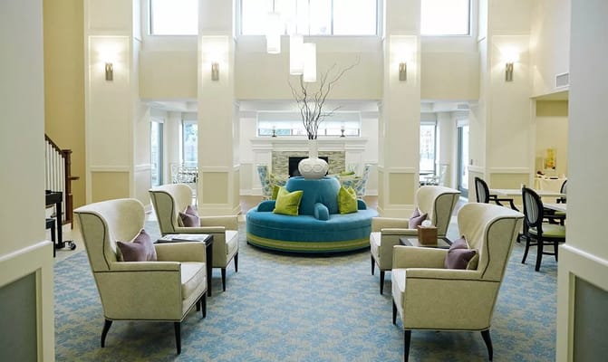 Bright living room with comfortable seating and a decorative centerpiece.