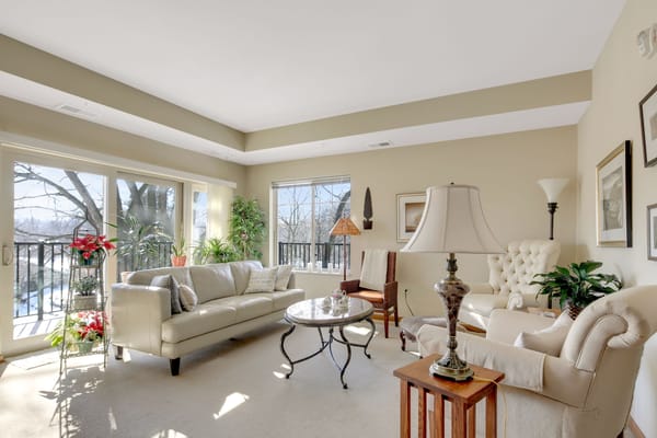 Bright living room with comfortable seating and large windows