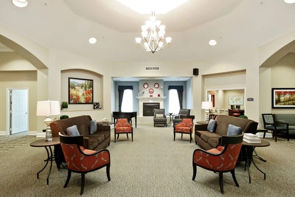 Cozy lounge area with seating and a fireplace