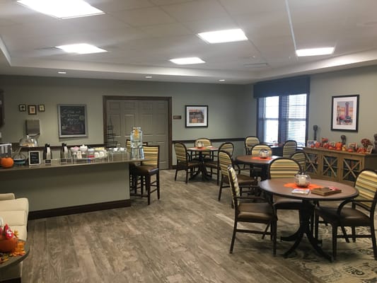 Bright dining area with tables and chairs