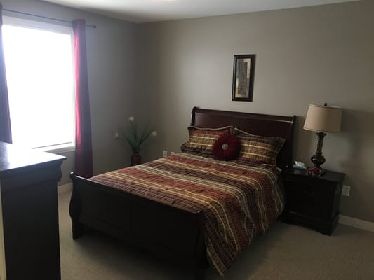 Cozy resident room with a bed and furnishings