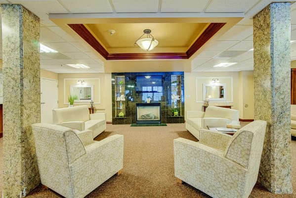 Living room area with comfortable seating and a fireplace