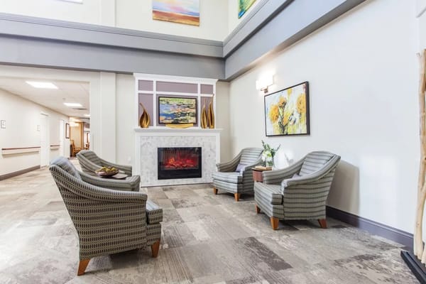 Common area with seating and fireplace