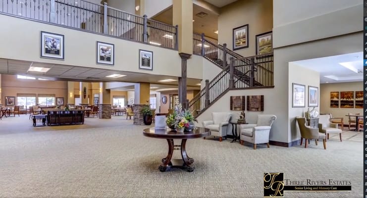 Bright and airy lobby area with seating and decorative elements.