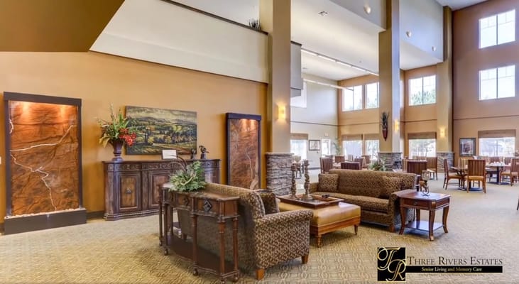 A cozy living room area with comfortable seating and decorative elements.