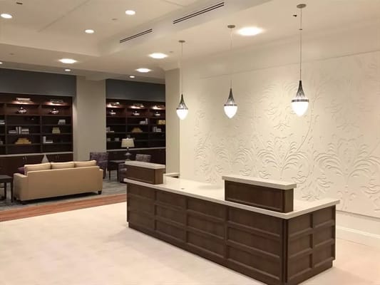 Interior view of a common area with seating and lighting.