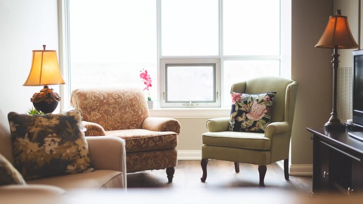 Cozy common area with comfortable seating and lamps