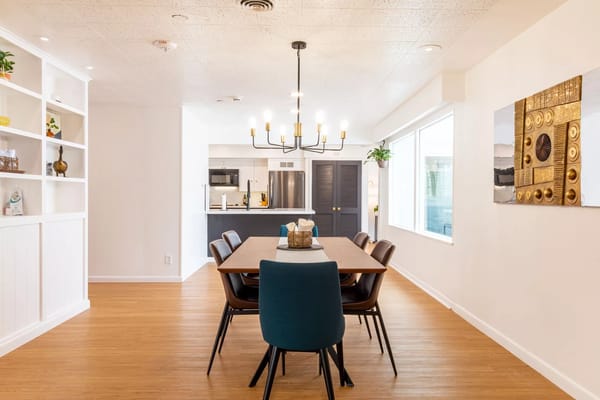 Bright dining area with wooden table and modern decor