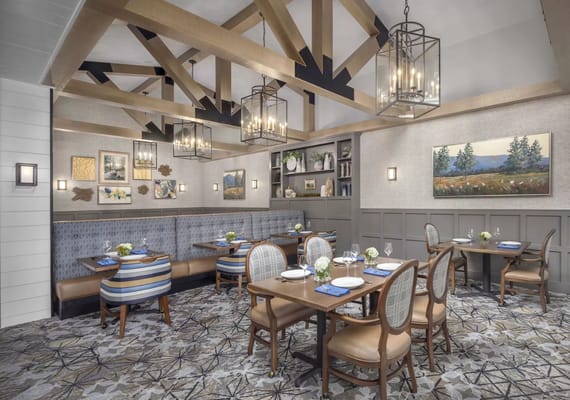 Elegant dining room with wooden beams and comfortable seating