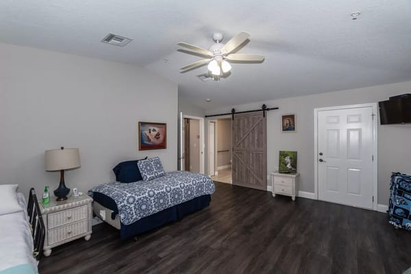 Spacious bedroom with two beds and modern decor