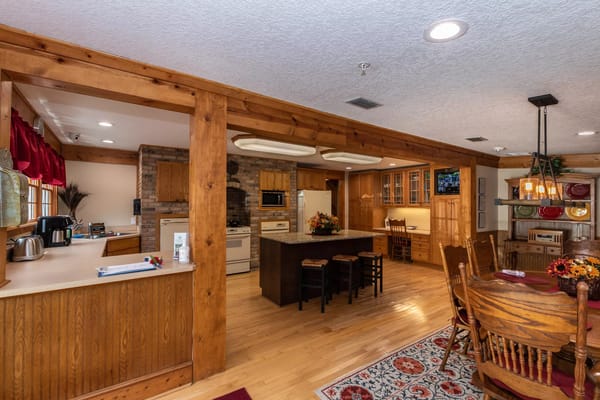Spacious kitchen with wooden cabinets and dining area