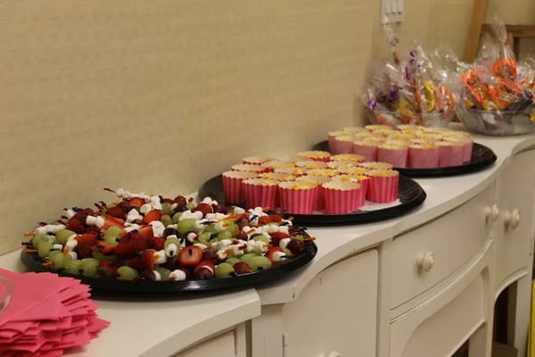 Buffet display of colorful fruit and sweets