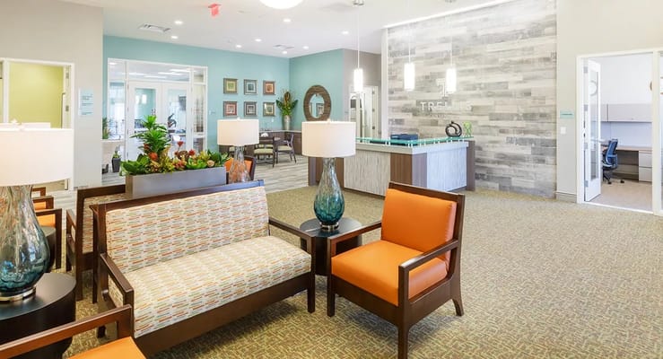 Lobby seating area with modern decor at Trellis Centennial.
