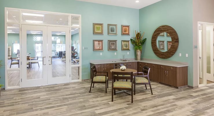 Bright and welcoming lounge area with seating and decor