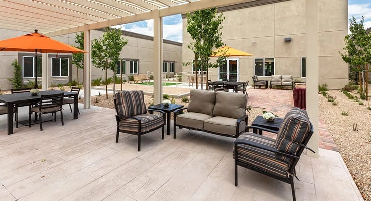 Relaxing outdoor patio area with seating and umbrellas