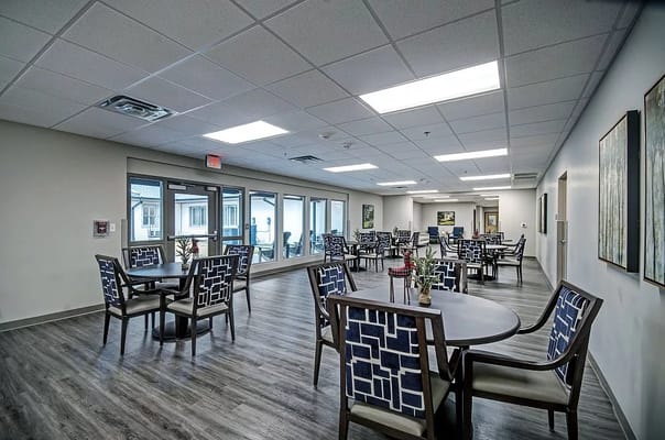 Bright and spacious dining area with tables and chairs